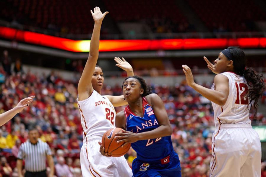 Kansas freshman guard Chayla Cheadle drives past senior guard/forward Brynn Williamson to sink a layup. Kansas defeated Iowa State 61-56.