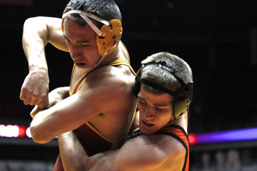 Redshirt junior Tanner Weatherman gets wrapped up by a Virginia Tech wrestler during his match. Weatherman had one takedown and two escapes as Iowa State won 21-12 Jan. 18. 