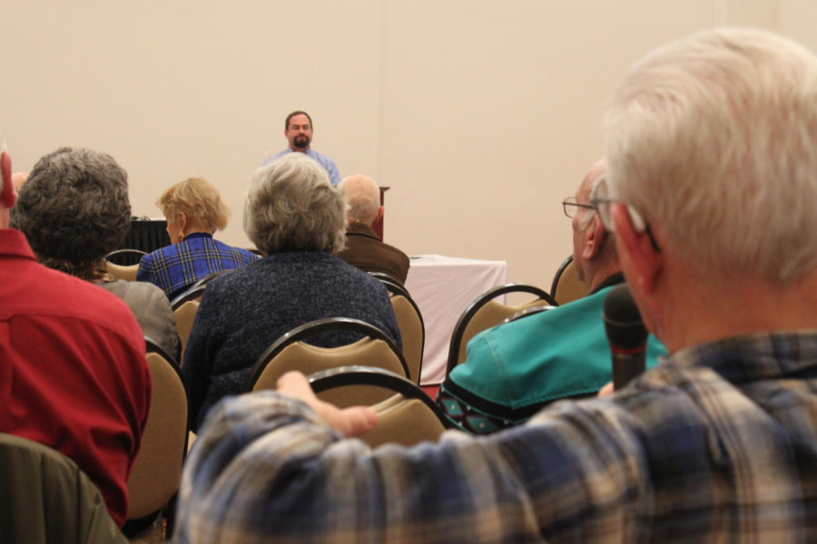 An audience member asks James Romer a question about the Iowa State Fair camper reservations during a presentation on Jan. 15 at the Alumni Center.