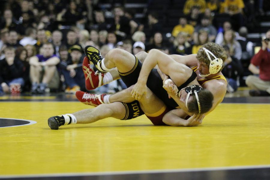 Redshirt senior Luke Goettl faces off against Iowa’s Michael Kelly. Goettl lost a lead late in the third period after a reversal then near-fall combination by Kelly, losing the 157-pound match 11-6 in the Cy-Hawk Series duel which took place on Nov. 29 in Iowa City. The No. 15 Cyclones struggled to secure close matches, falling to rival No. 1 Iowa 28-8.