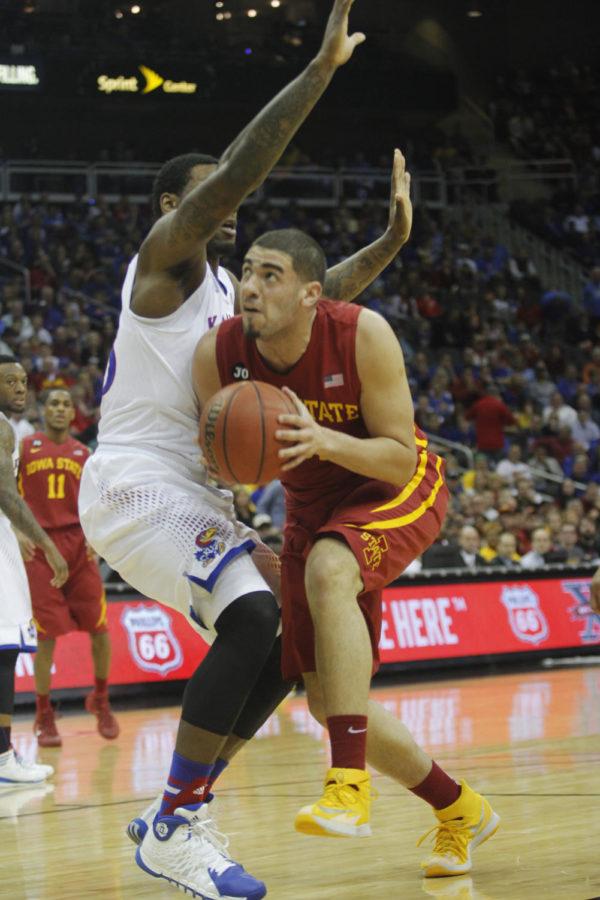 Sophomore forward Georges Niang pushes past a Kansas player during the Big 12 Championship semifinal game March 14 at the Sprint Center in Kansas City, Mo. The Cyclones defeated the Jayhawks 94-83.