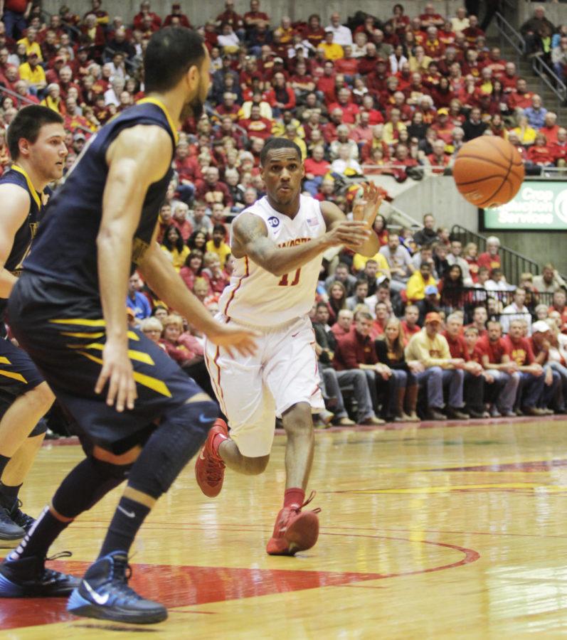 Freshman Monte Morris passes the ball during the second half of the game against West Virginia on Wednesday, Feb. 26, 2014. The No. 15 Cyclones defeated the Mountaineers 83-66.