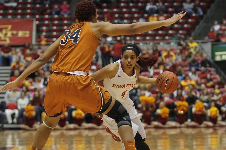 Senior guard Nikki Moody moves the ball up the court during Iowa States matchup against No. 3 Texas on Jan. 10. Moody scored 17 points with seven assists, marking the seventh game she has finished in double-digit scoring. Iowa State defeated the Longhorns 59-57.