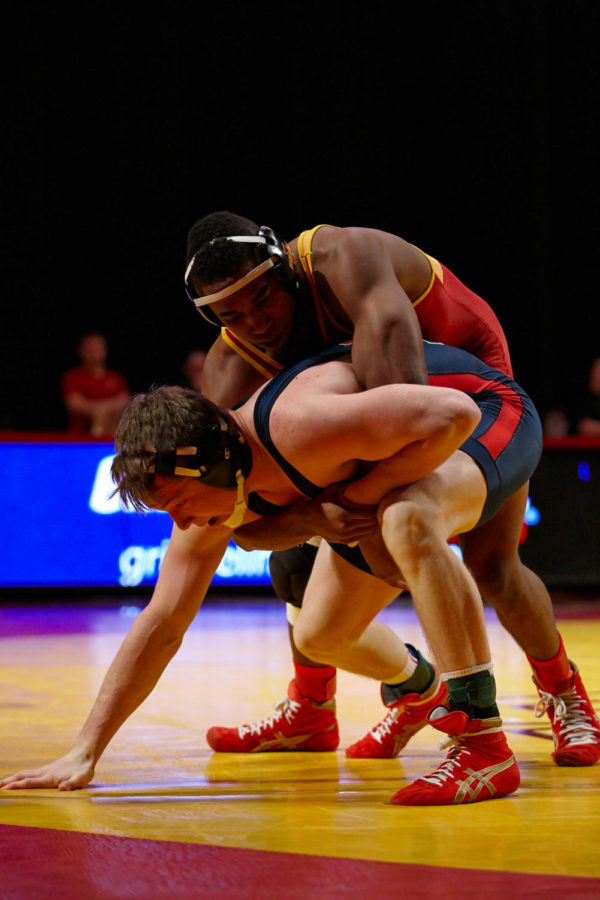 Redshirt sophomore Lelund Weatherspoon fights to get Penn freshman Joe Heyob onto the mat. Weatherspoon won the match to finish off Iowa States 41-3 victory.
