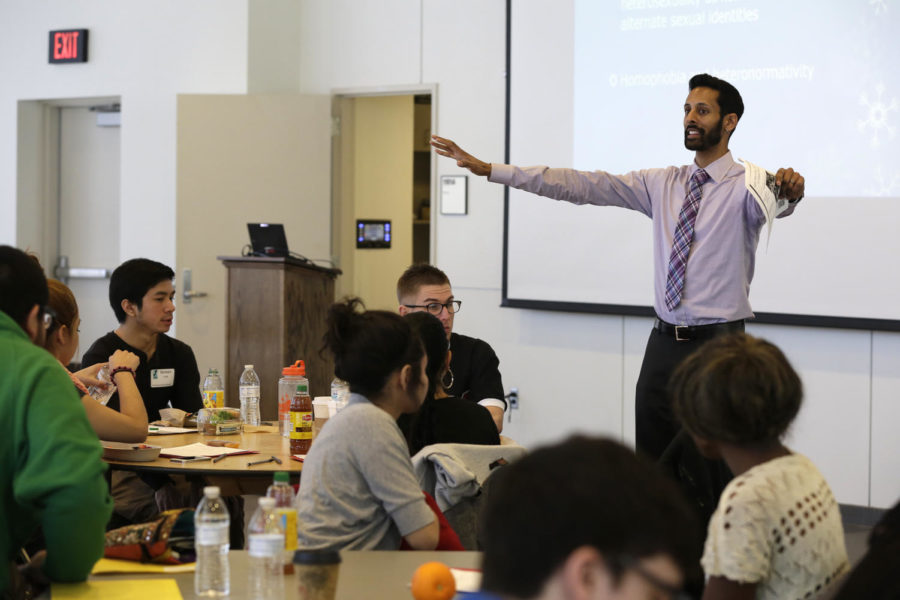 Guest Presenter Vijay Pendakur gives instructions for an exercise to attendees of the Social Justice Summit on Feb. 22 at Hach Hall. Pendakur is the director of the office of multicultural student success at De Paul University.