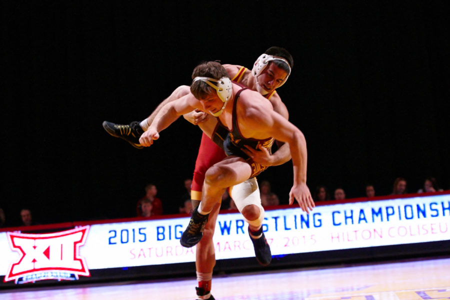 Redshirt senior Michael Moreno picks up Arizona State freshman Jacen Petersen before slamming him into the mat. Moreno's win was the first for Iowa State at the Feb. 13 match, which ended in a 27-6 win for the Cyclones.