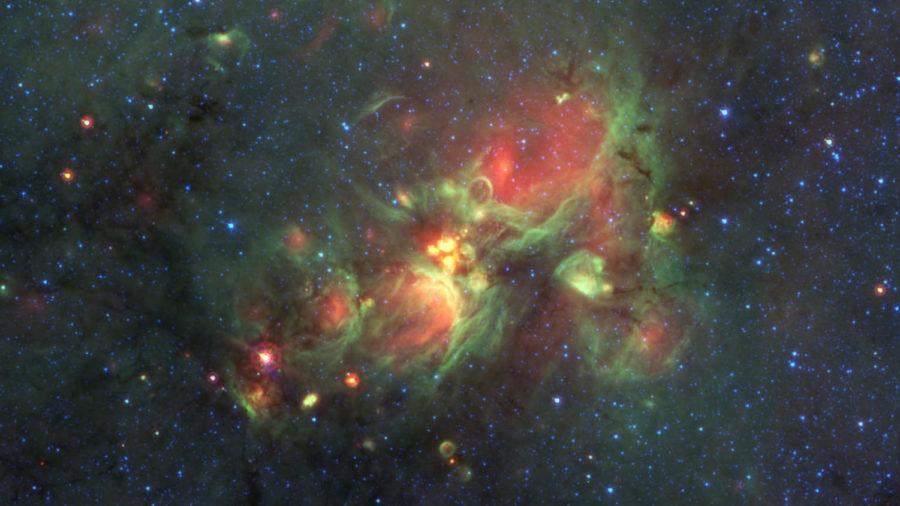 Citizen scientists helped identify and tag the yellowballs in this image, created by Spitzer Space Telescope. ISU professor Charles Kerton works on the Milky Way Project with a team of 35,000 citizen scientists to map star formations.