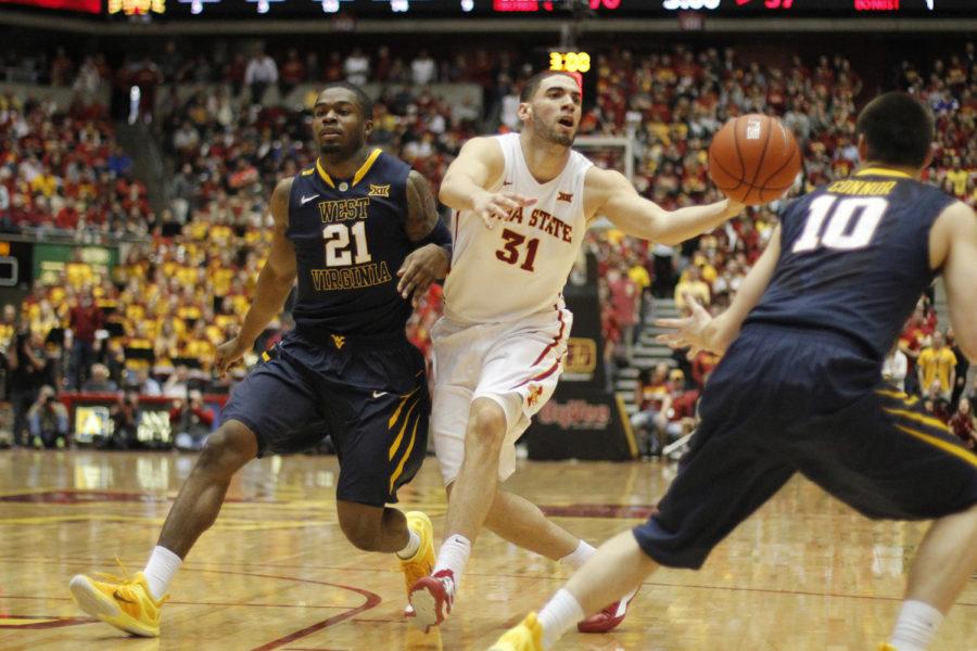 Senior forward Georges Niang snags the ball on a pass during Iowa States game against West Virginia on Feb. 14, 2015. Niang had the opportunity to learn from NBA stars at the Nike Basketball Academy last weekend. 