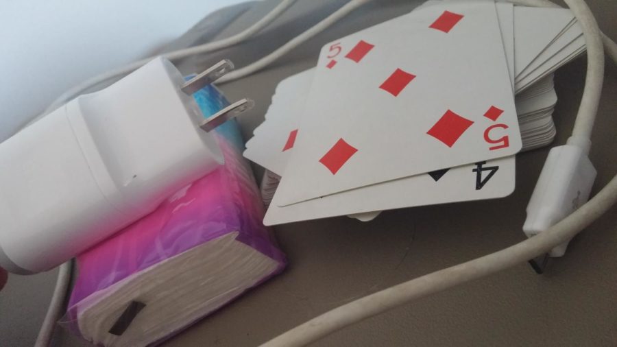 Spare car chargers, a deck of cards and tissues can all come in handy during Spring Break vacations.