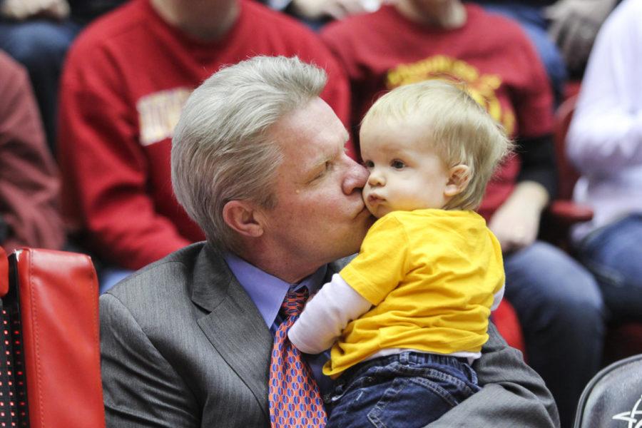 Coach Bill Fennelly kisses his grandson after the game against No. 3 Baylor on Feb. 28. The Cyclones defeated the Bears 76-71 on Senior Night. The game was Fennelly's 600th win at Iowa State.