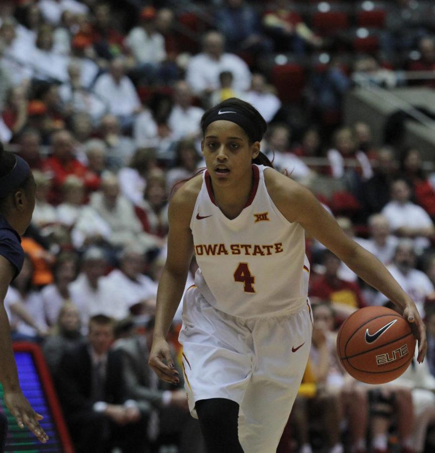 Senior guard Nikki Moody dribbles the ball down the court during the ISU womens basketball game against West Virginia on Feb. 7, 2015. Iowa State won 61-43.
