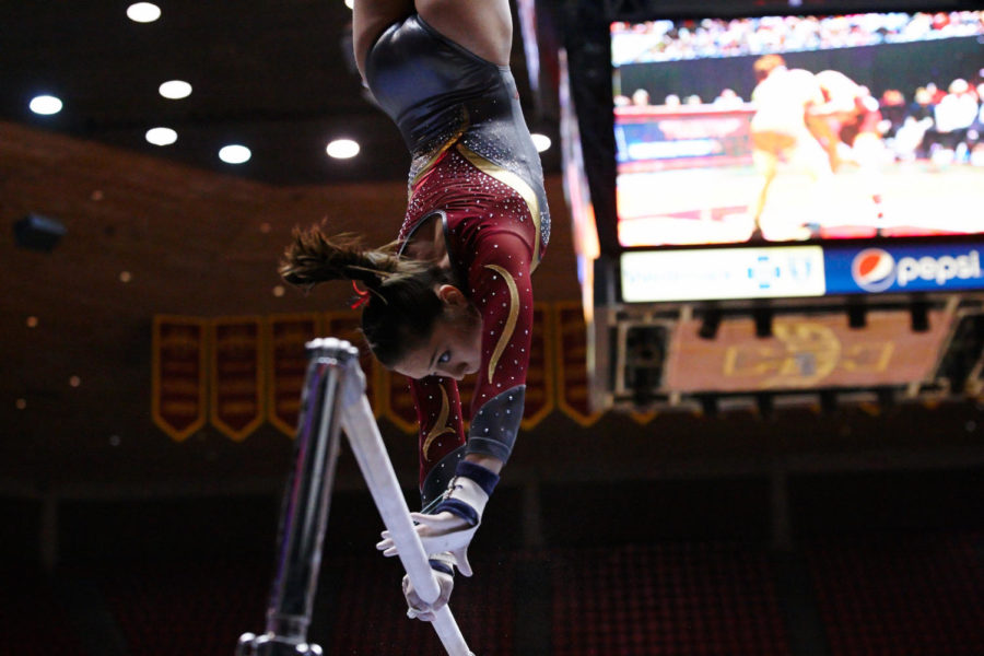 Freshman Briana Ledesma pauses at the top of her revolution to switch directions on the uneven bars. Iowa State lost to Oregon State 195.950-195.975 Jan. 18. 