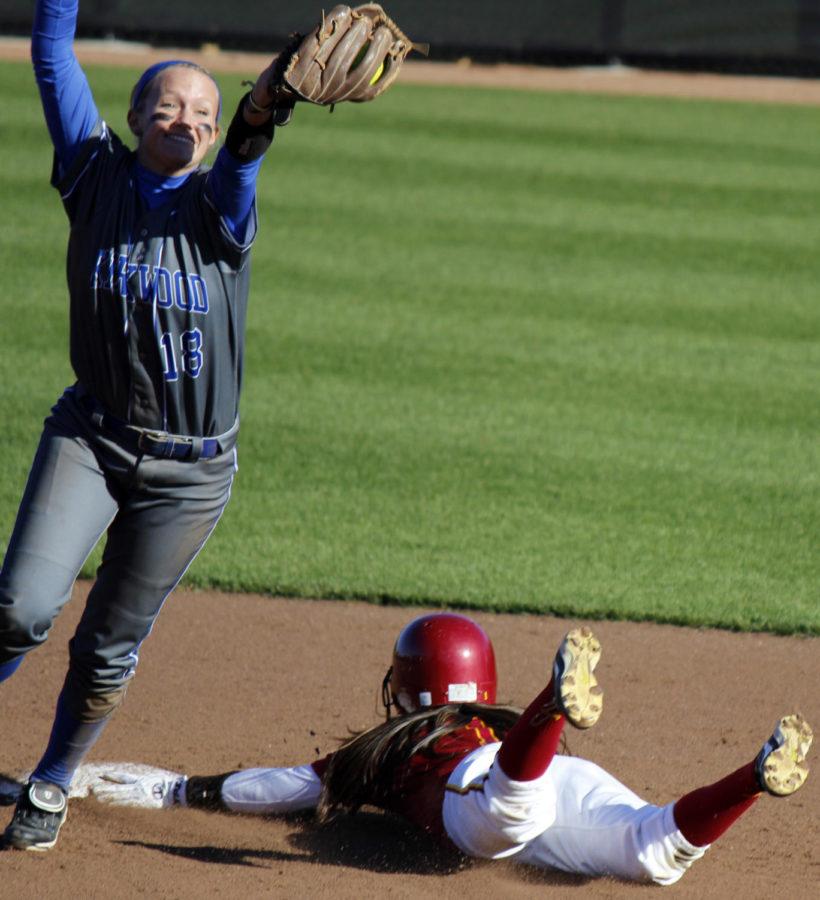 Junior Brittany Gomez, infielder and outfielder, slides into second base as the Kirkwood Eagles miss the catch. Iowa State softball won both games against the Eagles on Oct. 18 at the Cyclone Sports Complex.