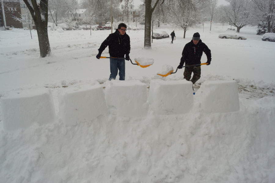 Two members of Theta Chi Faternity, Nick Lafrenz, sophomore in journalism and mass communication and Kaleb McKone, freshman in biology build a snow fort out side of their fraternity house. Winter Storm Linus left a lot of snow Feb. 1.