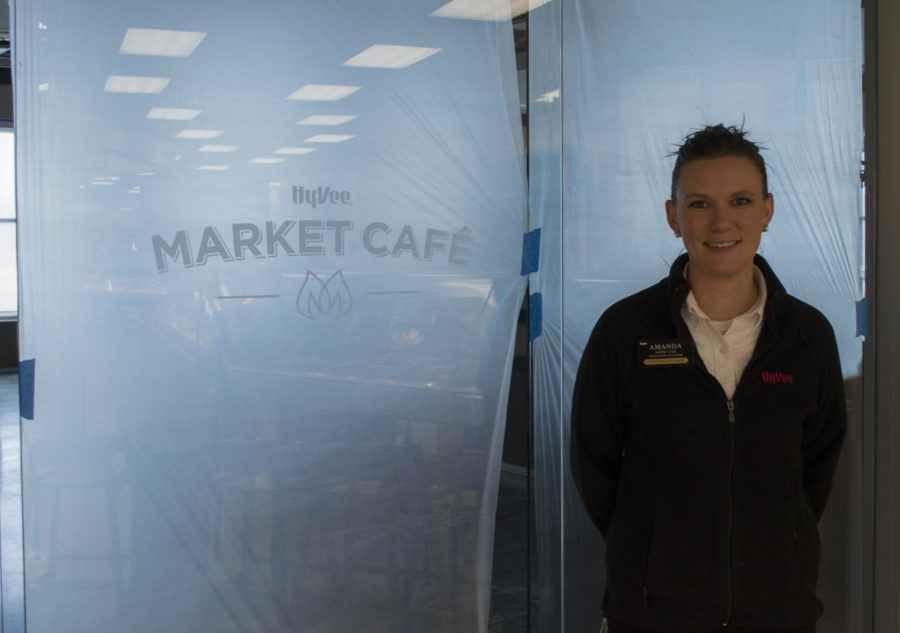 Market Café manager Amanda Vande Lune stands in front of the sectioned off area of Hy-Vee that is under construction in order to create a new café.