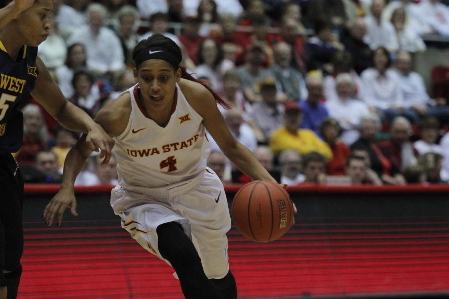 Senior guard Nikki Moody rushes down the court with the during the ISU womens basketball game against West Virginia on Feb. 7, 2015. Iowa State won 61-43.