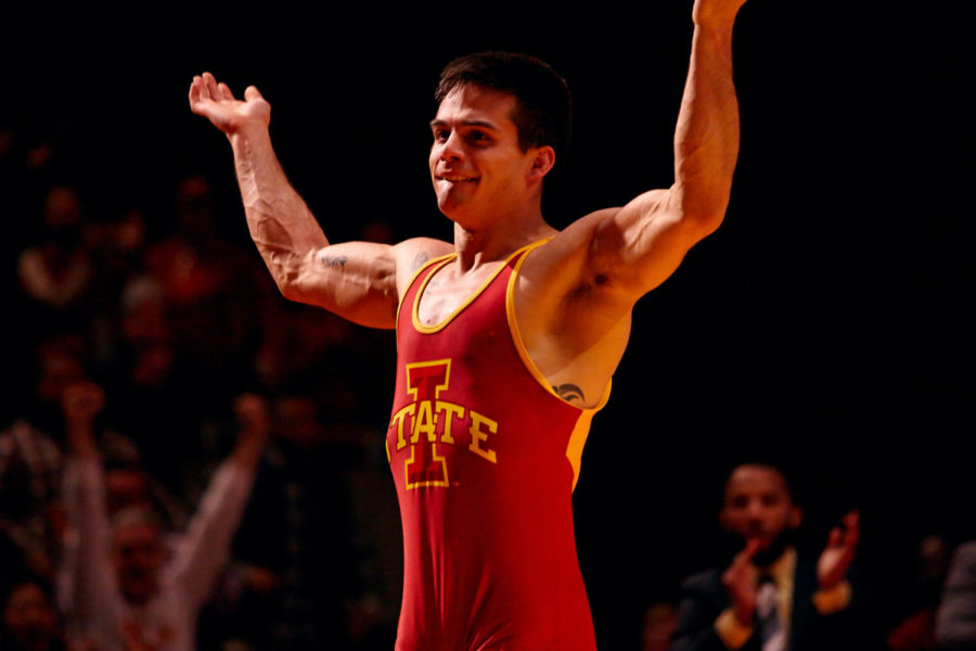 Redshirt senior Michael Moreno celebrates in an outpour of emotion after pinning No. 2 Isaac Jordan of Wisconsin on Feb. 22 at Hilton Coliseum.