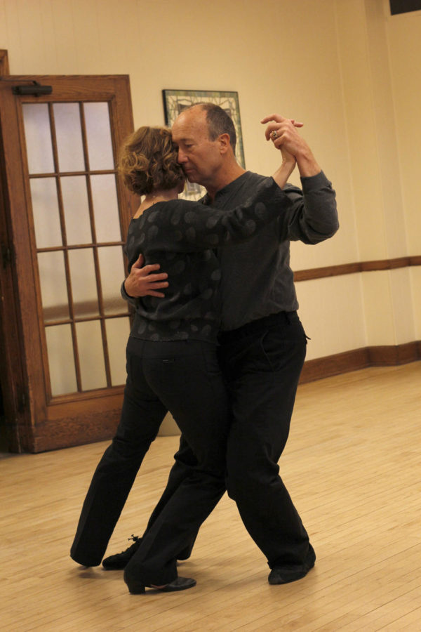 Professional dancer Valerie Williams dances with Larry Gleason, an ISU graduate who has been going to her classes for eight years, during her Argentine Tango class Feb. 1 in room 3512 of the Memorial Union.
