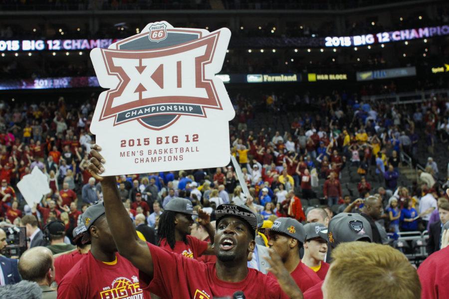 Senior forward Dustin Hogue holds up a Phillips 66 Big 12 Championship poster after Iowa State defeated Kansas 70-66 to win the championship on March 14 at the Sprint Center in Kansas City, Mo.