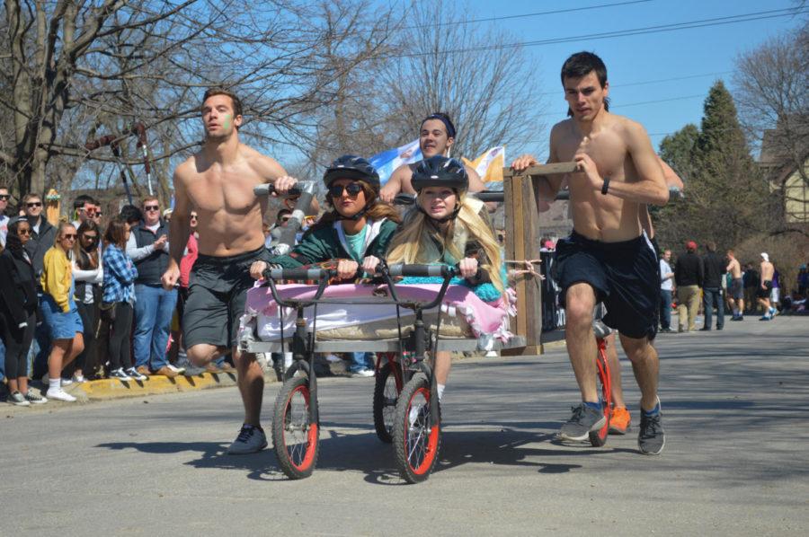 The team known as "Bob Barker's Brigade" crosses the finish line of the Greek Week bed race. The group consists of the sorority Kappa Delta and the fraternities Pi Kappa Alpha, Adelante and Delta Sigma Phi.