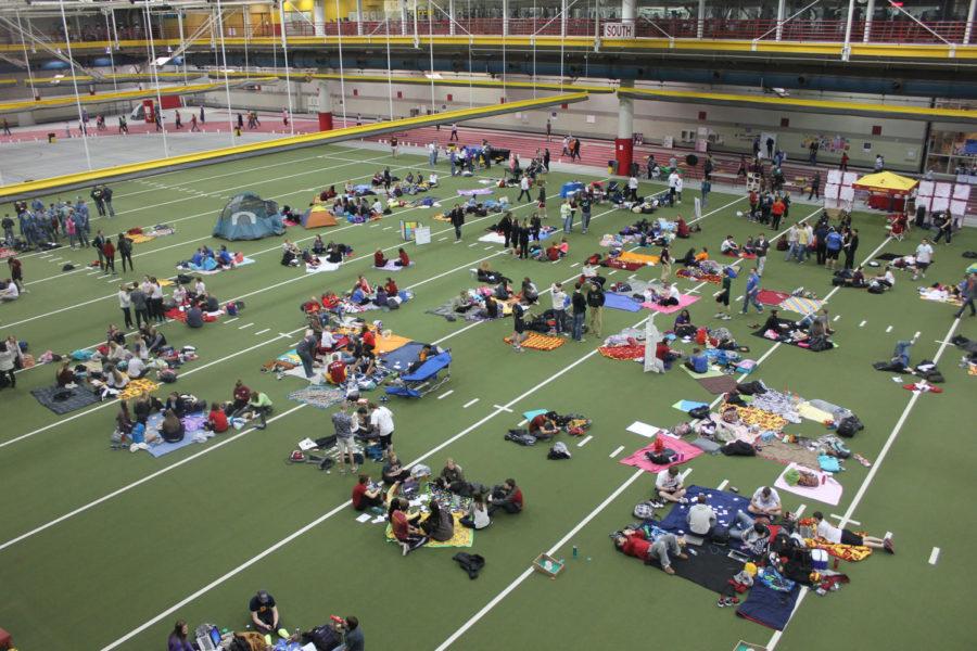 Relayers spread out blankets for small campsites on the field of the Lied Recreation Athletic Center.