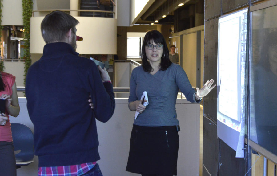 Nadia Anderson, assistant professor of architecture and urban design, discusses public interest design with students in her interdisciplinary design studio class at the Bridge Studio in the College of Design. Public interest design takes ecological, economic, and social issues into account when designing products, structures, and systems.