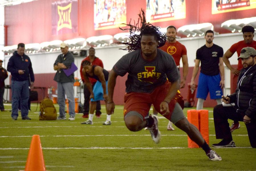 E.J. Bibbs makes a cut during a drill at Pro Day on Tuesday at the Bergstrom practice facility.