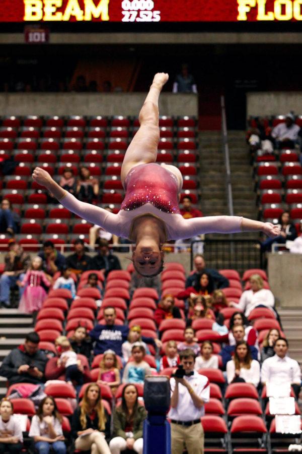 Freshman Haylee Young inverts during her routine on the beam.