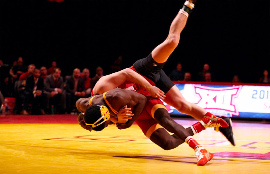 Junior Earl Hall flips his opponent to the mat.
