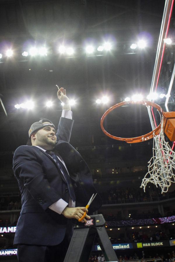 Assistant coach Matt Abdelmassih holds up his piece of the net after Iowa State defeated Kansas 70-66 in the 2015 Big 12 Championship final on March 14 at the Sprint Center in Kansas City, Mo.