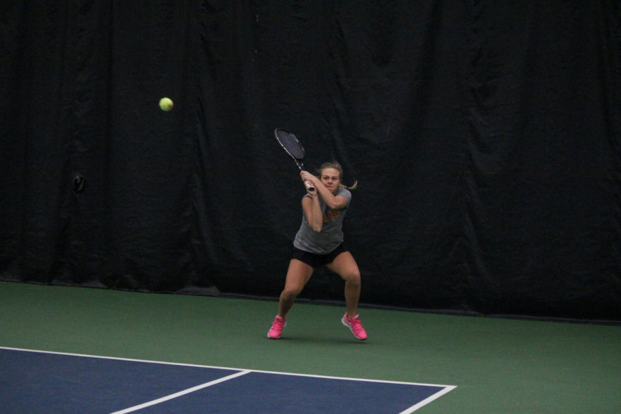 Senior+Ksenia+Pronina+sends+the+ball+over+the+net+during+her+singles+match+against+Oklahoma+on+Feb.+22.+The+Cyclones+lost+4-2.