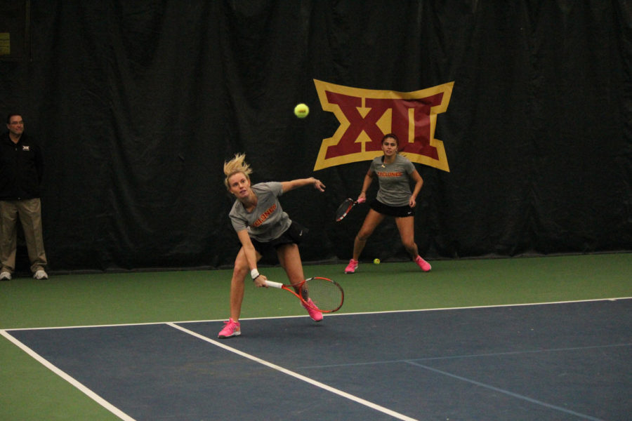 Senior Caroline Hauge Andersen returns the ball during the doubles matches against Oklahoma on Feb. 22, 2015. The Cyclones lost 4-2.