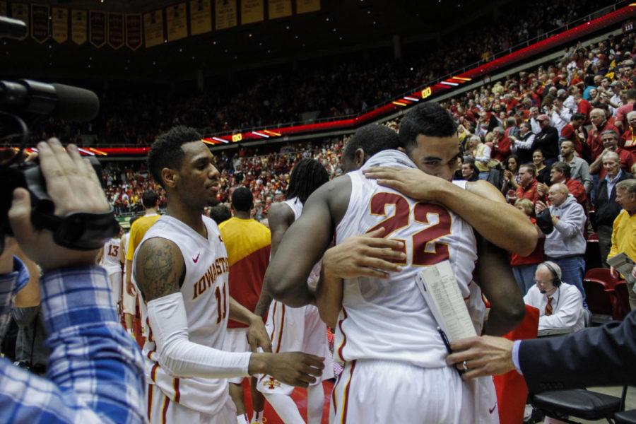 Dustin Hogue, Naz Long and Monté Morris celebrate the win against No. 15 Oklahoma at Hilton Coliseum on March 2. The No. 17 Cyclones defeated the Sooners 77-70 after a rocky 18-point first half.