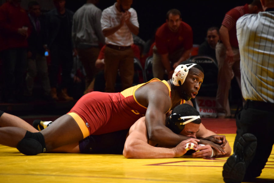Redshirt+senior+Kyven+Gadson+looks+to+the+official+during+his+match+against+Northern+Iowas+Basil+Minto%C2%A0on+Feb.+15+at+Hilton+Coliseum.
