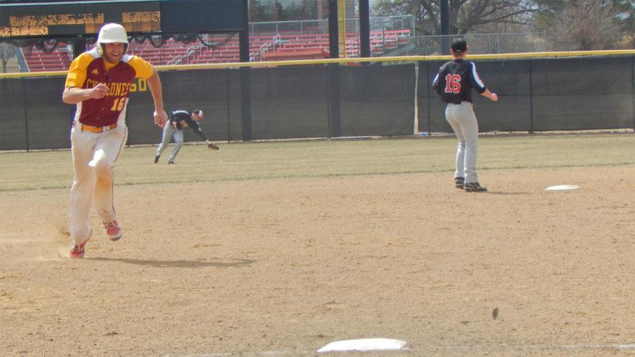 Catcher Adam Schmidt heads for third and eventually home after a single to centerfield on March 29.