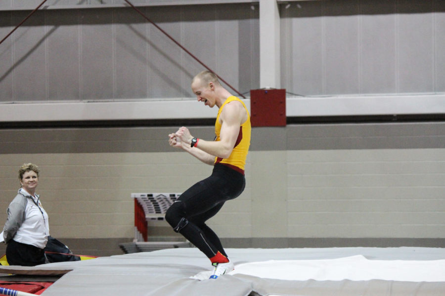 Redshirt Junior Taylor Sanderson celebrates after clearing the bar in the pole vault portion of the heptathlon at the Big 12 Indoor Track and Field Championship. Sanderson tied for fourth place with a jump of 4.48 meters at Lied Recreation Athletic Center on Feb. 28, 2015.
