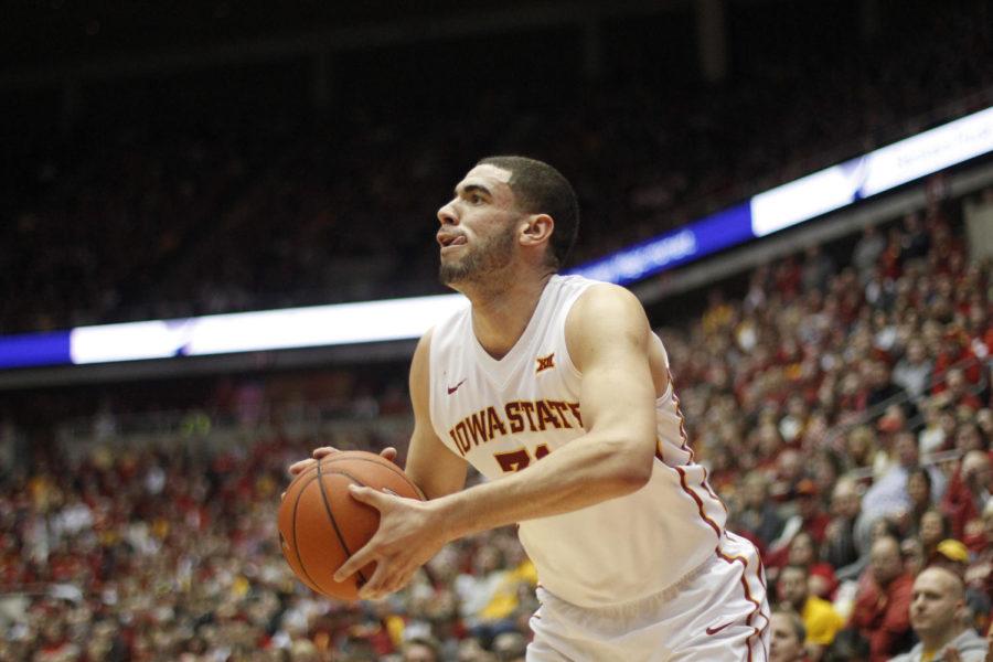 Junior forward Georges Niang sets himself for a shot outside the 3-point line during Iowa States game against West Virginia on Feb. 14. Niang finished with 11 points and two assists, helping the Cyclones defeat the Mountaineers 79-59.