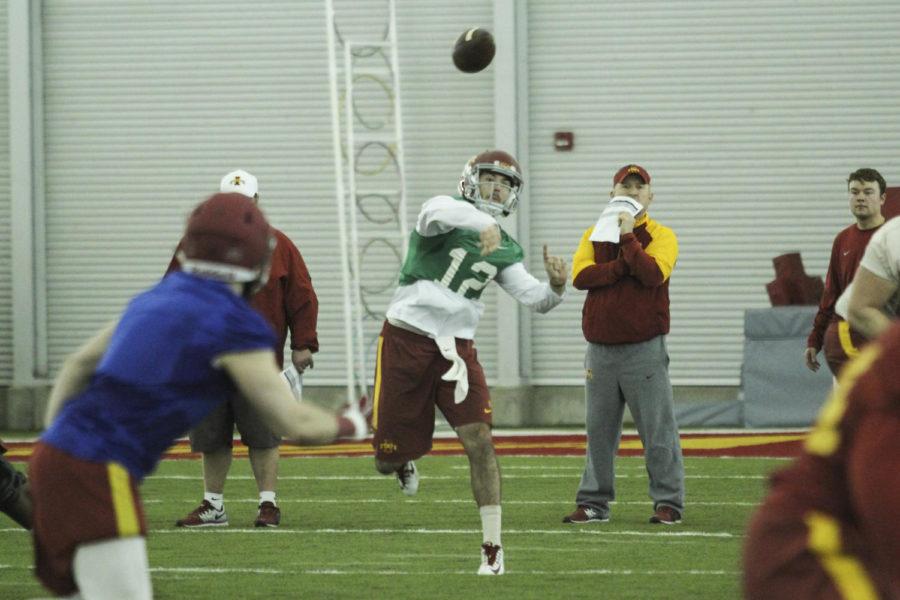 Redshirt senior quarterback Sam Richardson passes the ball at the first football practice March 3 at Bergstrom Indoor Practice Facility.