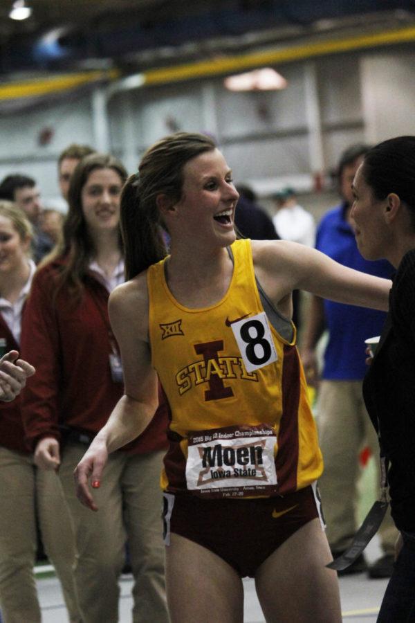 Senior Katy Moen is congratulated on her second-place finish in the 3000-meter run during the Big 12 Indoor Championship at Lied Recreation Athletic Center on Feb. 28. Texas took the trophies for both mens and womens track and field.