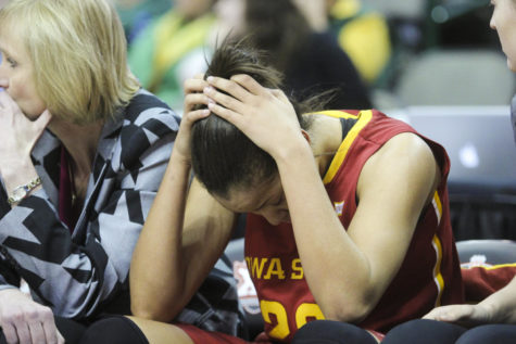 Senior Brynn Williamson puts her head down after fouling out with 24 seconds left in the 2015 Big 12 Championship quarterfinal game against Oklahoma State in Dallas, Texas on March 7. Williamson finished the game with 16 points and 11 rebounds.