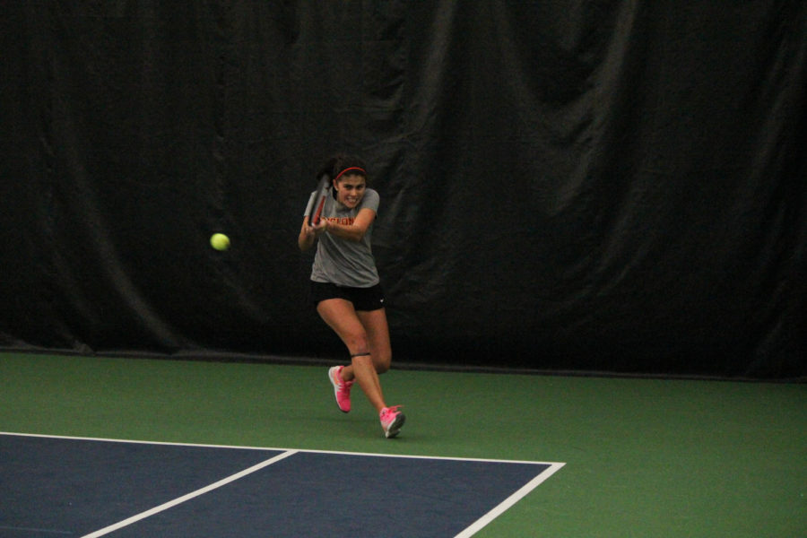 Junior Alejandra Galvis returns the ball to her Oklahoma opponent on Feb. 22, 2015. The Cyclones lost 4-2.
