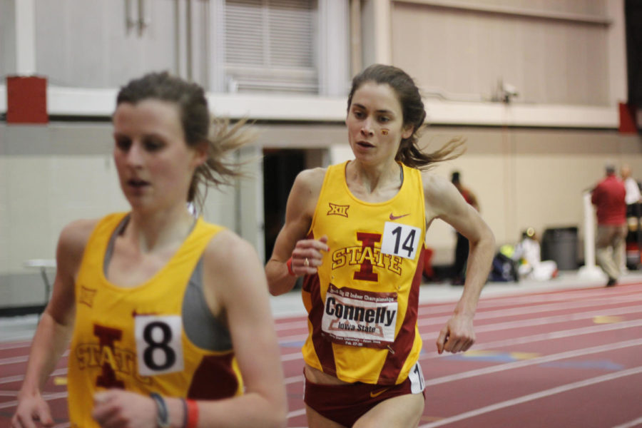 Senior Katy Moen and graduate student Margaret Connelly run to second and third-place finishes at the Big 12 Indoor Championship at Lied Recreation Athletic Center on Feb. 28. Texas took the trophies for both mens and womens track and field.