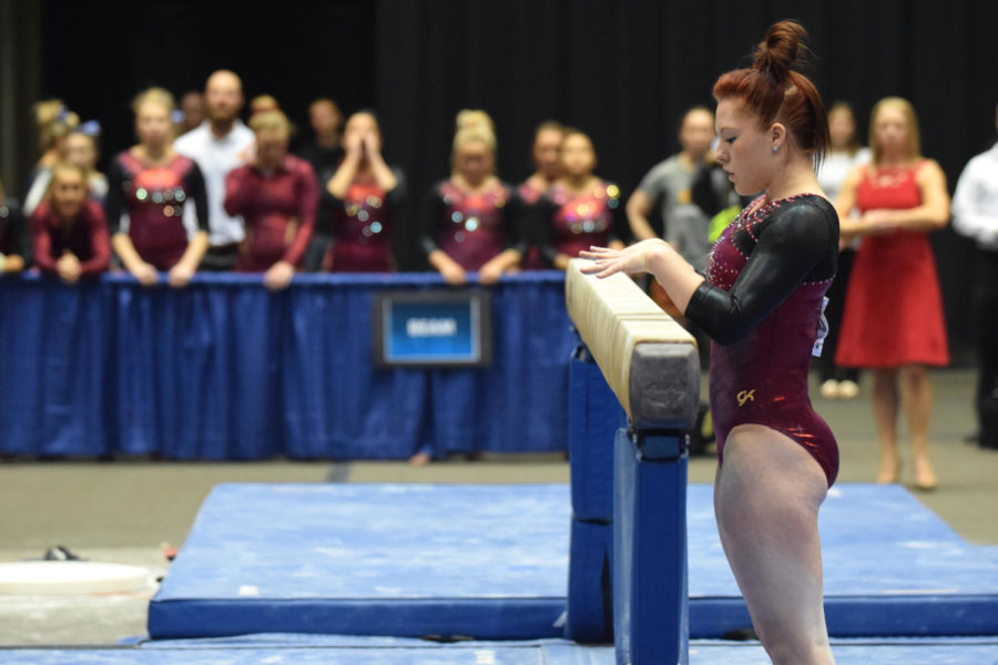 Sophomore+Lark+Pokladink+prepares+to+get+on+the+beam+at+the+NCAA+Regionals+on+Saturday+at+Hilton+Coliseum.