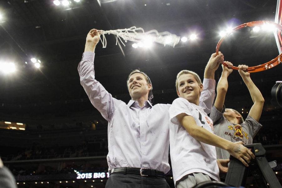 ISU coach Fred Hoiberg waves around the net with his twin sons after Iowa State defeated Kansas 70-66 in the 2015 Big 12 Championship on March 14 at the Sprint Center in Kansas City, Mo.