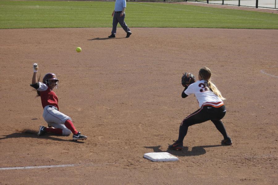 Brittany Gomez slides onto third base during Iowa States second game of a doubleheader against Oklahoma State on Saturday. The Cyclones won the game 8-7.