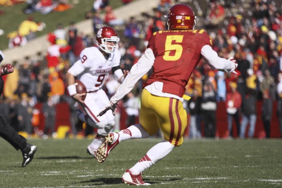 Redshirt freshman defensive back Kamari Cotton-Moya chases down Oklahoma quarterback Trevor Knight on Nov .1 at Jack Trice Stadium. The Cyclones suffered their 16th straight loss to the Sooners with a final score of 59-14. The Cyclones allowed 751 yards of offense to Oklahoma.