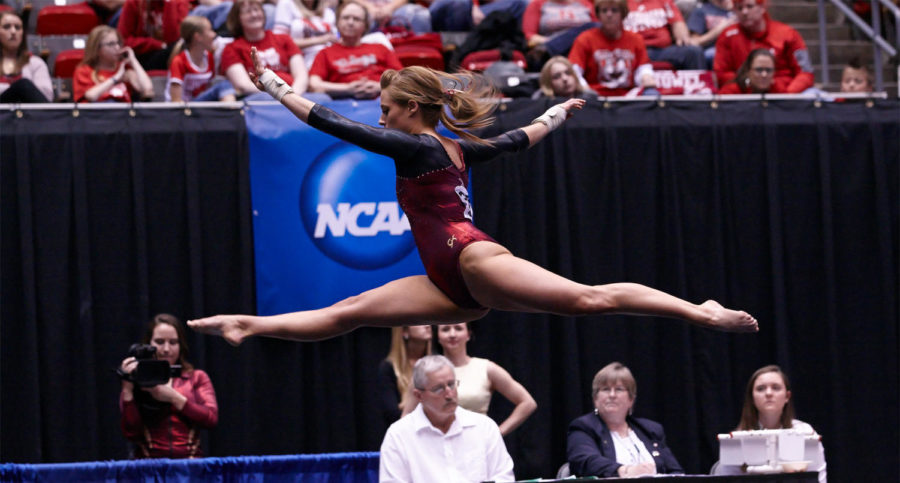 Senior Caitlin Brown leaps into the air during her floor routine at the NCAA Regionals on Saturday. Iowa State placed fifth.
