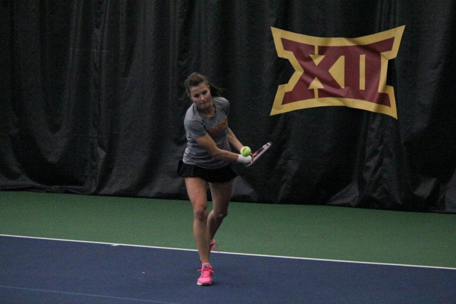 Sophomore Natalie Phippen sends the ball over the net to her Oklahoma opponent on Feb. 22, 2015. The Cyclones lost 4-2.