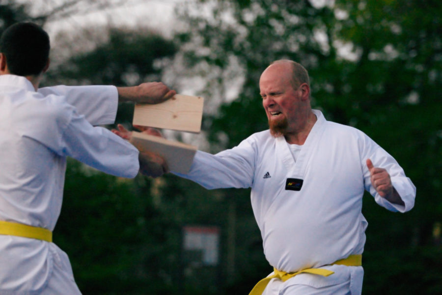 Dale Brown chops through a board during a taekwondo demonstration outside of the Memorial Union on April 20.