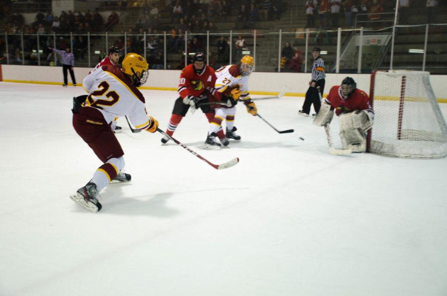 Alec Wilhelmi shoots to Alex Stephens for a goal. The Cyclones won the Feb. 13 game 2-0.